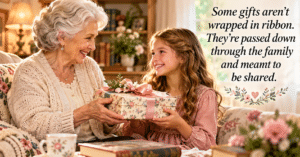 Grandmother handing a wrapped gift to her granddaughter, showing inherited gifts passed down through family