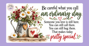 Farmhouse galvanized pitcher of daisies and red wildflowers beside a heart mug, ordinary day quote